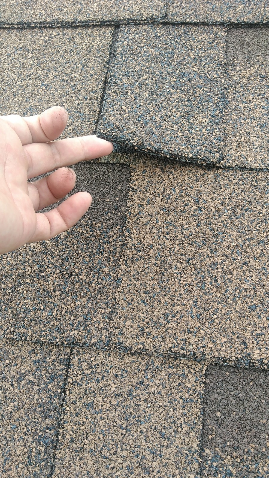 屋根材の接着の剥がれ